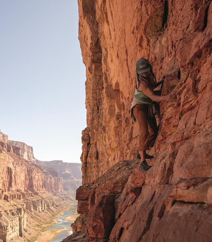 Female rock climber wearing a sleeveless top Female rock climber wearing a sleeveless top